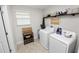 A bright laundry room with modern appliances at 1044 Oliveto Verdi Ct, Brandon, FL 33511