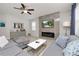 Cozy living room with a modern fireplace and an open layout for entertaining at 1044 Oliveto Verdi Ct, Brandon, FL 33511