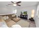 Inviting living area with neutral tones, a comfortable sectional, and sleek media center at 1044 Oliveto Verdi Ct, Brandon, FL 33511