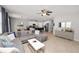 Open-concept living room with a plush sectional couch, and neutral decor at 1044 Oliveto Verdi Ct, Brandon, FL 33511