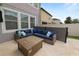 Cozy patio area featuring an outdoor couch and fire pit, perfect for entertaining or relaxing outside at 1044 Oliveto Verdi Ct, Brandon, FL 33511