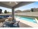 Relaxing outdoor area with a pool, spa, and seating under a covered patio at 1044 Oliveto Verdi Ct, Brandon, FL 33511