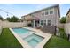 Outdoor oasis with a pool, spa, and cozy seating area for relaxing at 1044 Oliveto Verdi Ct, Brandon, FL 33511