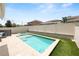 Inviting backyard featuring a pool, spa, and lush artificial grass at 1044 Oliveto Verdi Ct, Brandon, FL 33511