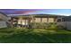 Spacious backyard with lush green grass, covered patio, and attractive landscaping at 11825 Frost Aster Dr, Riverview, FL 33579