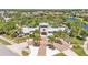 Community clubhouse with well-manicured landscaping and palm trees at 11825 Frost Aster Dr, Riverview, FL 33579
