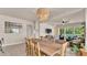 Open dining room with a large table, seamlessly connecting to living areas and offering ample space at 11825 Frost Aster Dr, Riverview, FL 33579