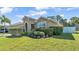 Beautiful home with lush landscaping, stone accents, and a well-manicured lawn at 11825 Frost Aster Dr, Riverview, FL 33579