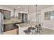 Well-equipped kitchen with modern appliances, a breakfast bar, and sleek cabinetry at 11825 Frost Aster Dr, Riverview, FL 33579