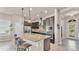 Open kitchen with stainless steel appliances, granite countertops, and a breakfast bar at 11825 Frost Aster Dr, Riverview, FL 33579