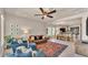 An open concept living room and dining area featuring stylish furnishings and plenty of natural light at 11825 Frost Aster Dr, Riverview, FL 33579