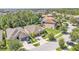 Aerial of well-maintained homes in a suburban neighborhood with driveways and green spaces at 11825 Frost Aster Dr, Riverview, FL 33579