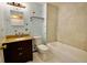 Bathroom featuring a granite vanity, tile surround, and a shower-tub combination at 12212 Hidden Brook Dr, Tampa, FL 33624