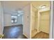 Spacious bedroom showcasing a walk-in closet and ample natural light at 12212 Hidden Brook Dr, Tampa, FL 33624