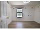 Bedroom with hardwood flooring, natural light, and view to pool at 12212 Hidden Brook Dr, Tampa, FL 33624
