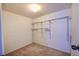Walk-in closet provides ample storage with shelving, rod and carpeted floor at 12212 Hidden Brook Dr, Tampa, FL 33624