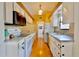 Well-lit kitchen with modern appliances, white cabinets, and hardwood floors is perfect for cooking at 12212 Hidden Brook Dr, Tampa, FL 33624