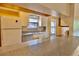 Efficient kitchen with granite countertops and white appliances, ideal for meal preparation at 12212 Hidden Brook Dr, Tampa, FL 33624