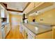 Functional kitchen layout featuring white cabinets, open to the dining area, perfect for entertaining at 12212 Hidden Brook Dr, Tampa, FL 33624
