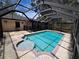 Relaxing screened-in pool with a spa and ample deck space is perfect for outdoor enjoyment at 12212 Hidden Brook Dr, Tampa, FL 33624