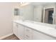 Bathroom with a double vanity, bright lighting, and large mirror at 2572 58Th E Cir, Palmetto, FL 34221