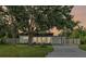 Charming single-story home featuring a modern design, well-manicured lawn, and inviting curb appeal at 275 Garden Rd, Venice, FL 34293