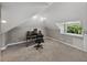 Attic office space featuring carpeted floors, and dormer windows at 2802 Midway Rd, Plant City, FL 33565