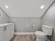 This bathroom features a toilet, vanity with modern fixtures and storage space providing convenience and style at 2802 Midway Rd, Plant City, FL 33565
