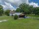 Detached carport near home and shed; provides covered parking and storage solutions on this large lot at 2802 Midway Rd, Plant City, FL 33565