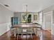 Dining room with hardwood floors, a large table and a blue cabinet at 2802 Midway Rd, Plant City, FL 33565