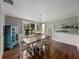 Dining room features a large table, beautiful floors and a blue cabinet at 2802 Midway Rd, Plant City, FL 33565