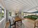 Cozy dining area with a wood table, chandelier, and views to the living room at 2802 Midway Rd, Plant City, FL 33565