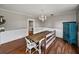 Spacious dining room with a large table and a blue cabinet at 2802 Midway Rd, Plant City, FL 33565