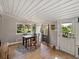 Bright dining room with natural light, wood floors, and cozy decor at 2802 Midway Rd, Plant City, FL 33565