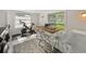 Laundry room features modern appliances, sink and exercise equipment at 2802 Midway Rd, Plant City, FL 33565