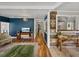 Open-concept living area showcases hardwood floors, stylish furnishings, and a rustic accent wall at 2802 Midway Rd, Plant City, FL 33565
