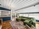Cozy living space with a comfortable green sofa, open to the dining and kitchen areas at 2802 Midway Rd, Plant City, FL 33565