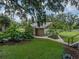 Exterior view of an outbuilding on a sprawling lot featuring mature trees and lush, green grass at 2802 Midway Rd, Plant City, FL 33565