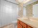 Bathroom features a toilet, shower, and vanity with wood drawers at 2815 Kebs Ln, Plant City, FL 33565