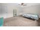 Bedroom featuring soft carpet, a mirror, and a colorful quilt at 2815 Kebs Ln, Plant City, FL 33565