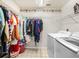 Functional laundry room equipped with a washer, dryer, and shelving at 2815 Kebs Ln, Plant City, FL 33565