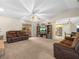 Spacious living room with comfortable seating, entertainment center and view into the kitchen at 2815 Kebs Ln, Plant City, FL 33565