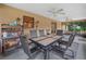 Spacious screened patio features outdoor dining, lighting, and views of the backyard at 2815 Kebs Ln, Plant City, FL 33565