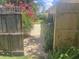 Charming backyard area, featuring a stone pathway lined with lush greenery and a view of the home at 4718 Crystal Ave, Sarasota, FL 34231