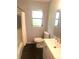 Bathroom featuring geometric wallpaper, black tile floor, shower and modern vanity at 4718 Crystal Ave, Sarasota, FL 34231
