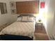 Comfortable bedroom featuring a cozy bed, natural light, and minimalist decor at 4718 Crystal Ave, Sarasota, FL 34231
