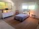 Bright bedroom with a comfortable bed, ample natural light, and neutral decor at 4718 Crystal Ave, Sarasota, FL 34231