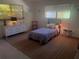 Bright bedroom featuring stylish furnishings, neutral rug and natural lighting at 4718 Crystal Ave, Sarasota, FL 34231