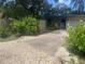 Charming home with lush landscaping, mature trees, and a private driveway at 4718 Crystal Ave, Sarasota, FL 34231