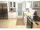 Bright kitchen with butcher block countertops, stainless steel appliances, and ample storage at 4718 Crystal Ave, Sarasota, FL 34231